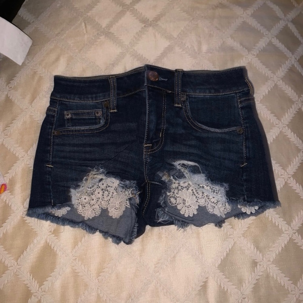 Distressed lace accent American eagle shorts